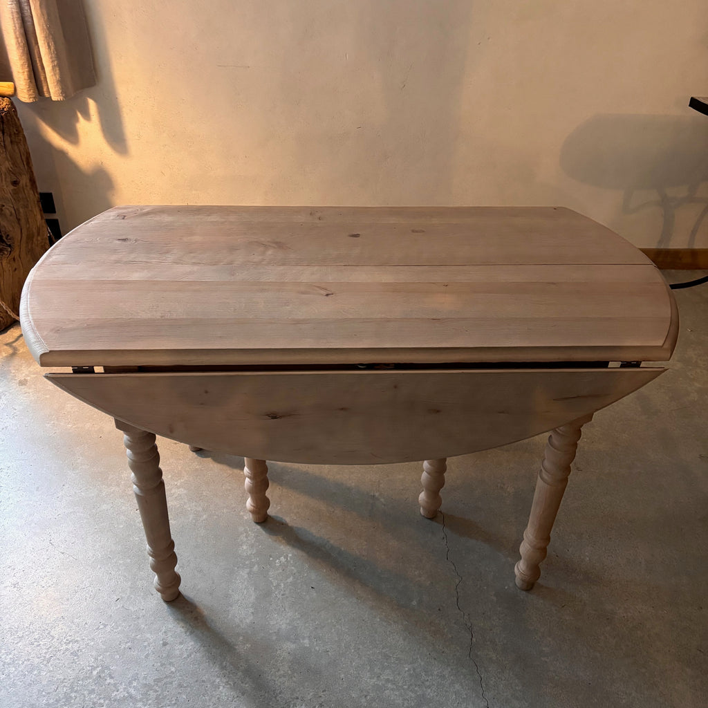 Table ronde à allonges
